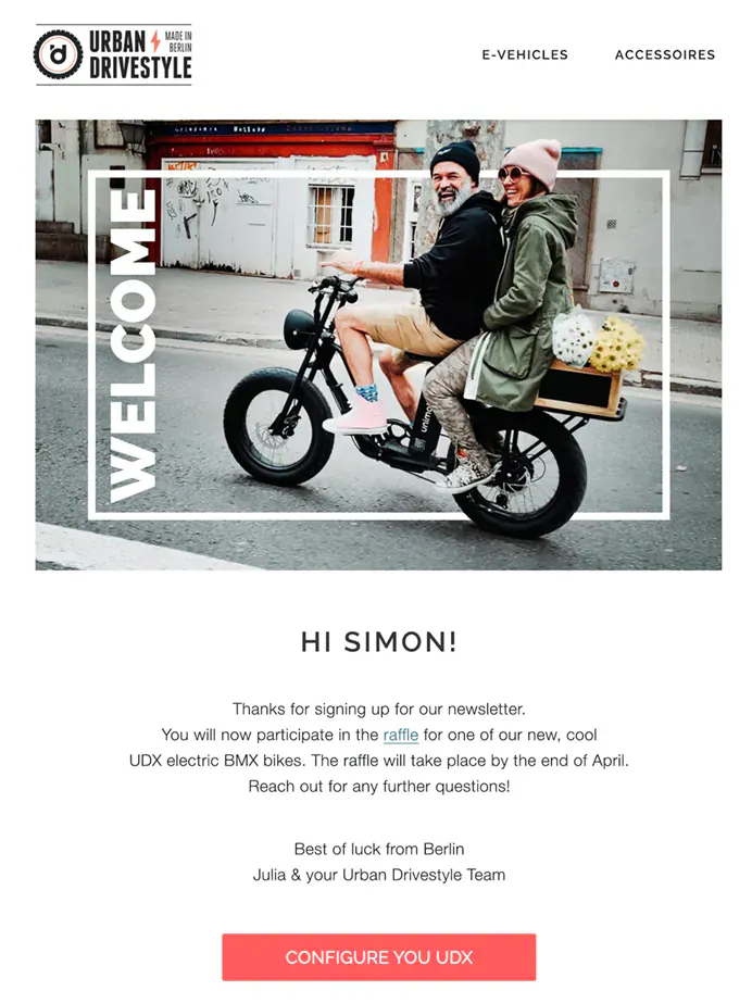 Urban Drivestyle welcome email: a couple riding a black electric bike with a crate of flowers, framed by the word “Welcome”, above a thank-you for entering the e-bike raffle and two of the bikes.